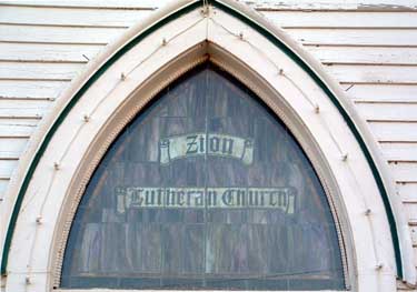Stained glass window above entry