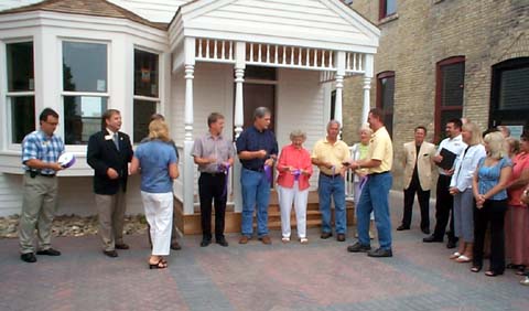 Ribbon cutting took place in front of the Douglas House, the Kassenborg block is to the right