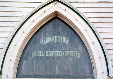 Stained glass window above entry